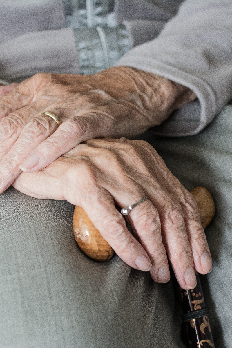 FAQs elderly person's hands crossed in lap